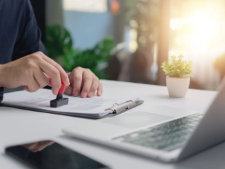 individual business person stamps document approval